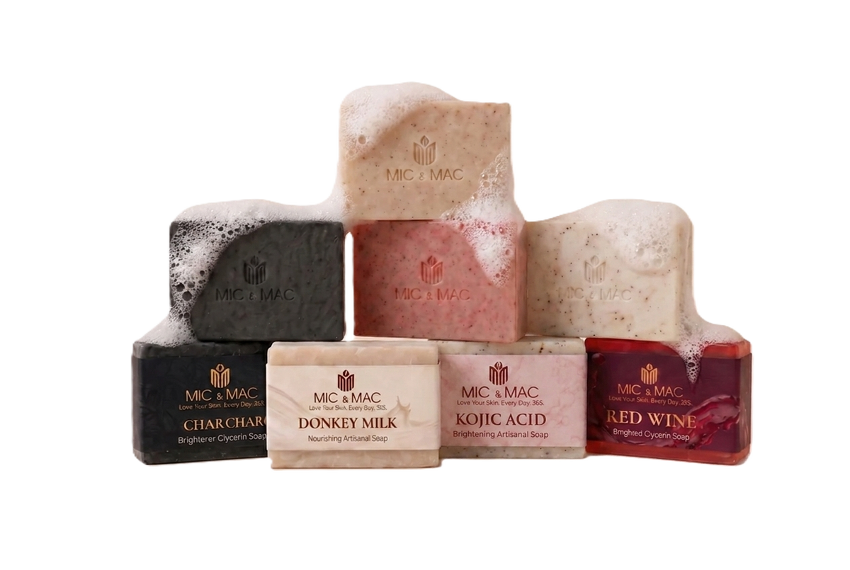 Collection of M&C soap bars with visible branding on a beige background