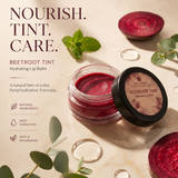 Mic & Mac Beetroot Tint Hydrating Lip Balm in a clear jar with its lid off, displayed on a warm beige background with beetroot slices, mint leaves, and eucalyptus branches. The brand logo and product details are printed on the left side of the image.